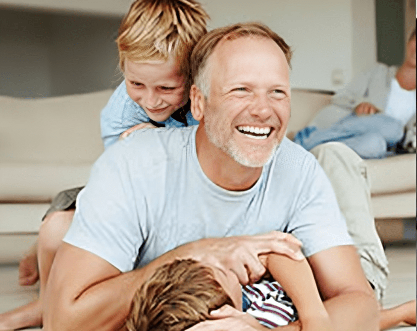 Smiling family playing and laughing together.
